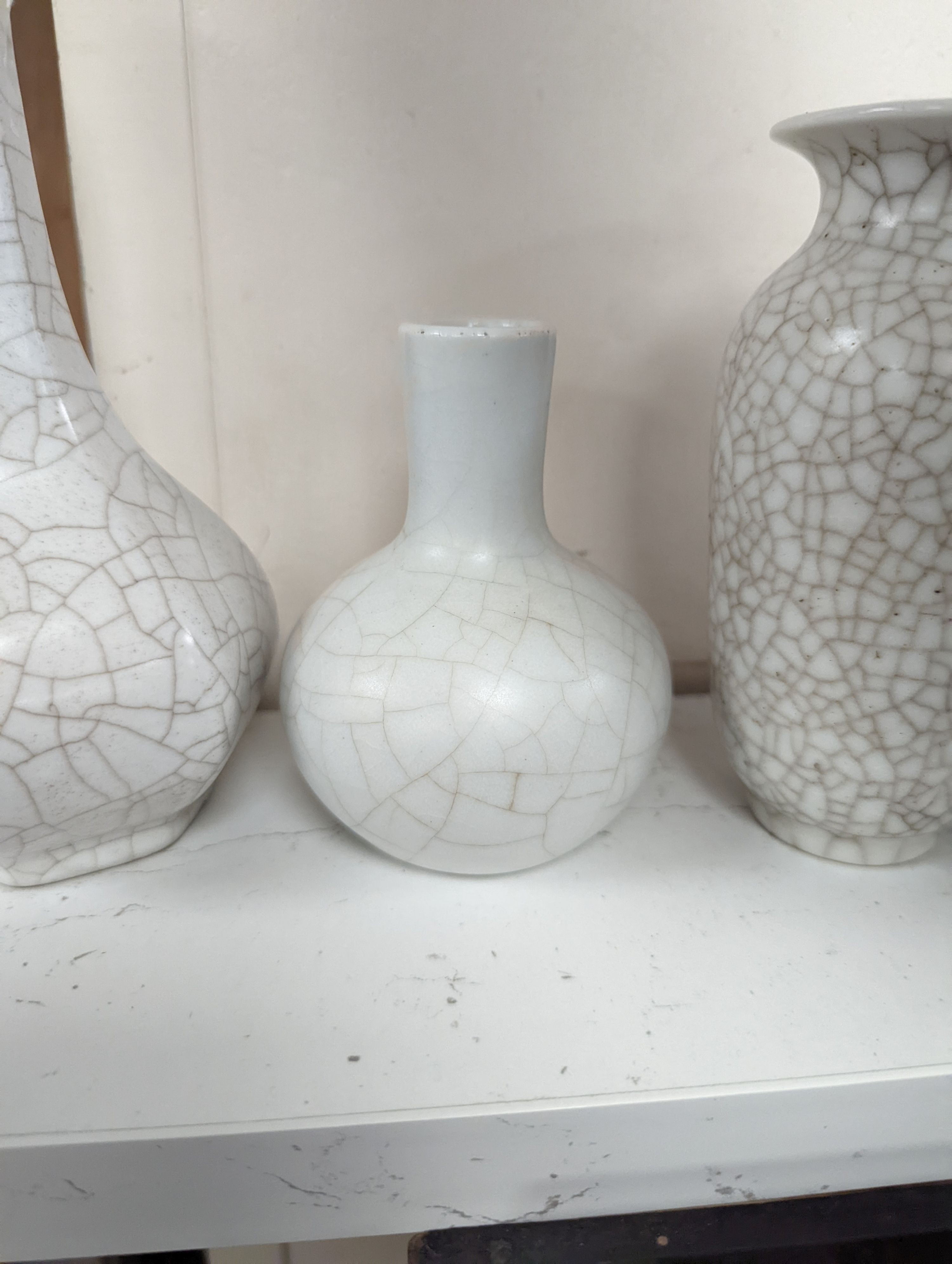 Four Chinese crackle glaze vases, tallest 16 cms high.
